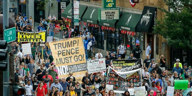 Demonstrators make their way through the streets of Chicago on Thursday to protest gun violence.