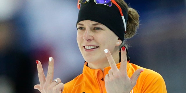 Feb. 9, 2014: Ireen Wust of the Netherlands flashes three fingers in each hand, indicating her third olympic gold medal, after winning gold in the women's 3,000-meter speedskating race at the Adler Arena Skating Center during the 2014 Winter Olympics in Sochi, Russia.