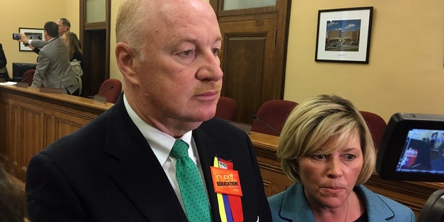West Virginia Education Association President Dale Lee, left, and American Federation of Teachers' West Virginia chapter President Christine Campbell talk to reporters as an agreement was reached by a legislative conference committee for a 5 percent pay increase for striking teachers Tuesday, March 6, 2018, at the Capitol in Charleston, W.Va.