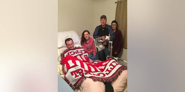 Wyatt Rees and his wife, Mindy, are pictured with the Clarks, who gave them an adaptive van after hearing about their story.