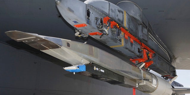 An X-51A WaveRider hypersonic flight test vehicle is uploaded to an Air Force Flight Test Center B-52 for fit testing at Edwards Air Force Base. Four scramjet-powered Waveriders were built for the Air Force. The Los Angeles Times says the unmanned X-51 WaveRider is expected to reach Mach 6 _ or about 3,600 mph _ Tuesday, Aug. 14, 2012, when it's dropped by a B-52 bomber and takes flight off the Southern California coast near Point Mugu.