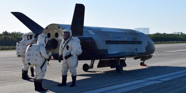 The U.S. Air Force's robotic X-37B space plane sits on the Shuttle Landing Facility runway at NASA's Kennedy Space Center shortly after a May 7, 2017, landing that ended the 718-day OTV-4 mission.