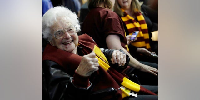 Sister Jean Dolores Schmidt sits with other Loyola-Chicago fans in Atlanta during a regional semifinal NCAA college basketball game against Nevada, March 22, 2018.