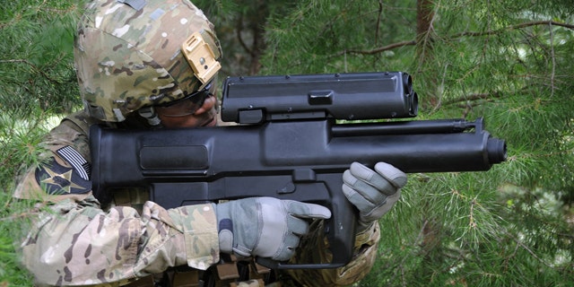 The XM25, designed by Minnesota's Alliant Techsystems, has been in development for about seven years and the first prototypes have been doled out to combat units in Afghanistan earlier this month. The 12-pound, 29-inch system, which costs up to $35,000 per unit, is so sophisticated that soldiers are proficient users literally within minutes. (U.S. Army)