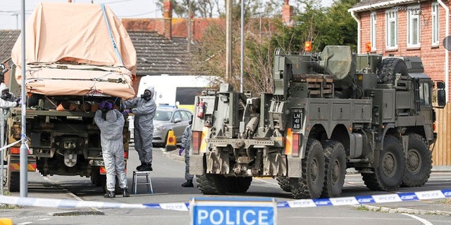 A tow truck is hauled away during the investigation of what British officials call a 'shocking' and 'reckless' poisoning on their soil.