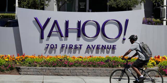 FILE - In this Tuesday, July 19, 2016 file photo, a cyclist rides past a Yahoo sign at the company's headquarters in Sunnyvale, Calif. (AP Photo/Marcio Jose Sanchez) (Copyright 2016 The Associated Press. All rights reserved.)