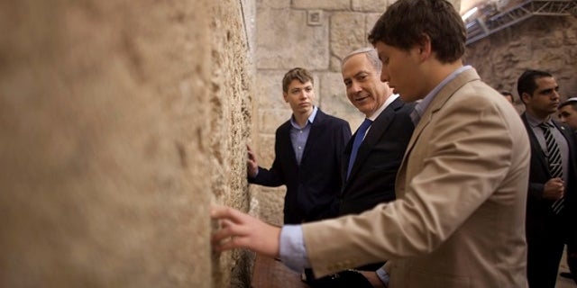 The Netanyahu's son, Yair (left), was captured on a recording joyriding at taxpayer expense to strip clubs with his friends.