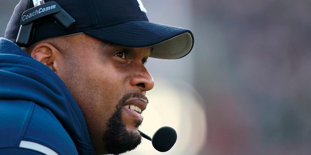 Nov. 20, 2010: This file photo shows Yale football coach Tom Williams watching from the sideline during the first half of a college football game against Harvard, in Cambridge, Mass.