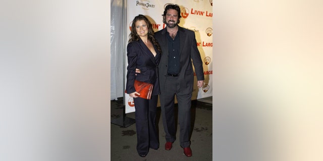 Yasmine Bleeth and partner Paul Cerrito at a party to celebrate the engagement of Carmen Electra to Dave Navarro at the Pacific Design centre in Los Angeles, CA in 2006.