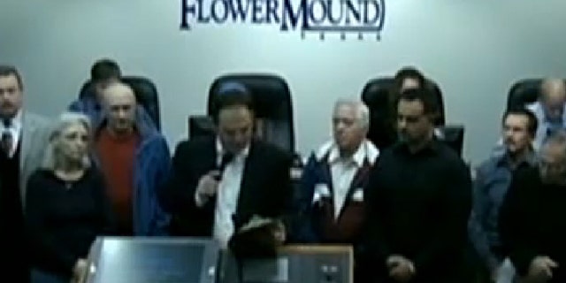 Mayor Tom Hayden declares 2014 the "year of the Bible" at a city council meeting in Flower Mound, Texas.