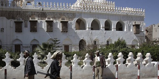 Jan. 25, 2012: Yemeni armed tribesmen stand guard in front of Ameriyah religious school which was seized by Al Qaeda militants in Radda town, 100 miles south of the capital Sanaa, Yemen.
