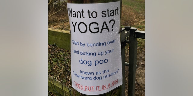 A humorous sign suggesting people do yoga by bending over to pick up their dog poo has gone viral.