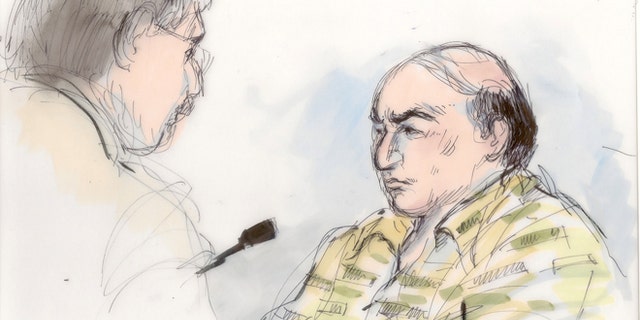Sept. 27, 2012: This file courtroom sketch shows shows Mark Basseley Youssef talking with his attorney Steven Seiden, left, in court in Los Angeles.