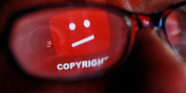 A picture illustration shows a YouTube error logo reflected in a person's eye, in central Bosnian town of Zenica, early June 18, 2014. (REUTERS/Dado Ruvic)