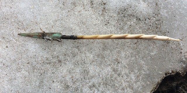 Close up of barbed antler arrow point with copper end blade shortly after it was removed from the ice. (Government of Yukon photo)