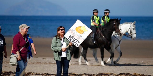 Police on horseback provide security at the Trump Turnberry golf resort in western Scotland.