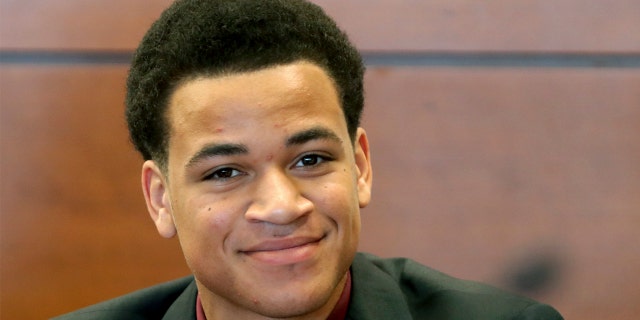 Zachary Cruz smiles during a hearing at the Broward County Courthouse in Fort Lauderdale, Fla., on May 11. A judge granted Cruz, brother of Stoneman Douglas shooting suspect Nikolas Cruz, permission to serve out his probation in Virginia for trespassing at Marjory Stoneman Douglas High School where his lawyer says a home, a job and educational opportunities await.