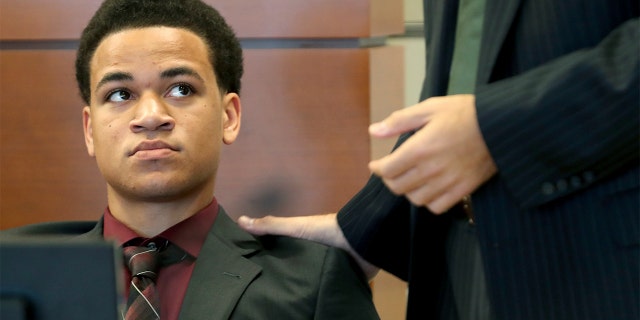 Zachary Cruz, left, seen during a hearing at the Broward County Courthouse in Fort Lauderdale, Fla., on May 11, told the Miami Herald that his brother Nikolas Cruz threatened both he and their mother with a gun on separate occasions.