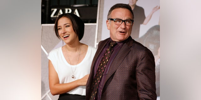 November 9, 2009. Actor Robin Williams (R) star of the new film "Old Dogs" poses with his daughter Zelda Williams as they arrive in Hollywood, California.
