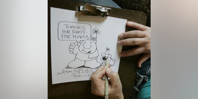 In this June 23, 2006 photo, Artist Tom Wilson Jr. draws a Ziggy cartoon celebrating the strip's 35th anniversary at his home in Loveland, Ohio.  Tom Wilson Sr, the creator of hard-luck comic strip character Ziggy has died, he was 80. Spokesman Josh Peres with Universal Uclick, the Kansas City, Missouri, syndication company formerly known as Universal Press Syndicate, says Wilson Sr. died Friday, Sept. 16, 2011 after a long illness. Wilson's son, Tom Wilson Jr., who has produced the panel since 1987, says his father died of pneumonia at a Cincinnati hospital.
