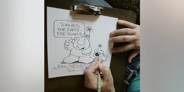 In this June 23, 2006 photo, Artist Tom Wilson Jr. draws a Ziggy cartoon celebrating the strip's 35th anniversary at his home in Loveland, Ohio. Tom Wilson Sr, the creator of hard-luck comic strip character Ziggy has died, he was 80. Spokesman Josh Peres with Universal Uclick, the Kansas City, Missouri, syndication company formerly known as Universal Press Syndicate, says Wilson Sr. died Friday, Sept. 16, 2011 after a long illness. Wilson's son, Tom Wilson Jr., who has produced the panel since 1987, says his father died of pneumonia at a Cincinnati hospital.