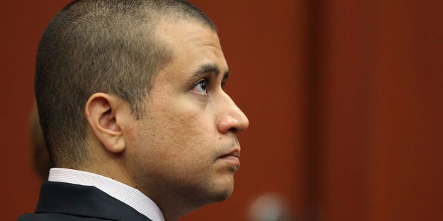 George Zimmerman, shown at an April 20 bond hearing in Sanford, Fla., began carrying a licensed handgun after a pit bull menaced his wife. (AP Photo/Orlando Sentinel, Gary W. Green, Pool)