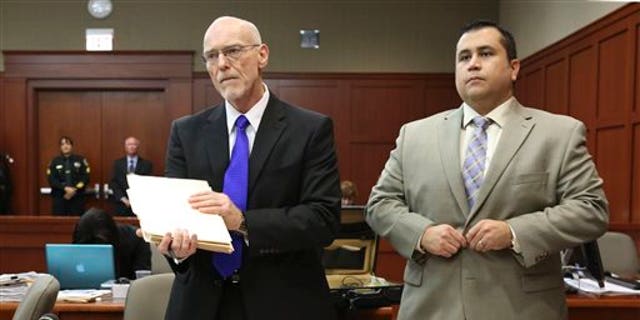 July 5, 2013: George Zimmerman stands next to one of his defense attorneys, Don West, during his trial in Seminole circuit court in Sanford, Fla. (AP/Pool Orlando Sentinel)