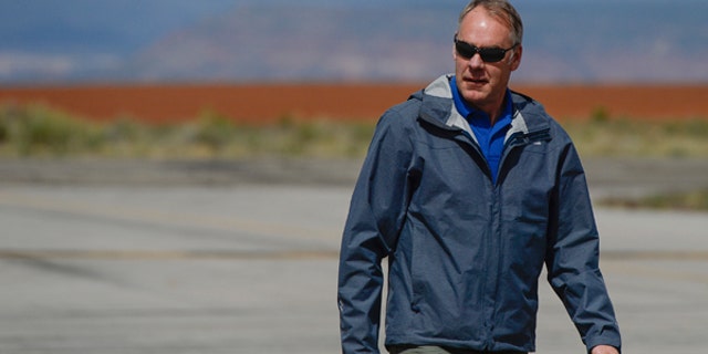 Interior Secretary Ryan Zinke arrives at the Blanding airport on Monday, May 8, 2017, for an aerial tour of the recently designated Bears Ears National Monument in southeastern Utah by President Barack Obama on Dec. 28, 2016. Utah Republicans in Congress are advocating for Trump to jettison Utah's national monument designation. (Francisco Kjolseth/The Salt Lake Tribune via AP)