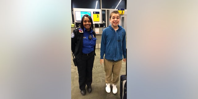 The TSA employee, Alesea, is seen posing with 13-year-old Zion in front of his gate at the Indianapolis International Airport.