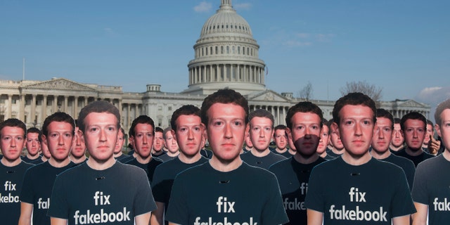 While Mark Zuckerberg prepares to testify before the Senate, 100 cardboard cutouts of the Facebook founder and CEO stand outside the U.S. Capitol in Washington on Tuesday, April 10, 2018.