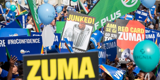 Protesters against President Jacob Zuma, march to parliament in Cape Town South Africa, Tuesday Aug. 8, 2017.