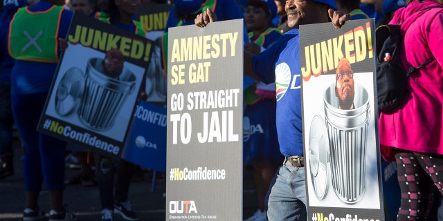 Protesters against President Jacob Zuma, march to parliament in Cape Town South Africa, Tuesday Aug. 8, 2017.