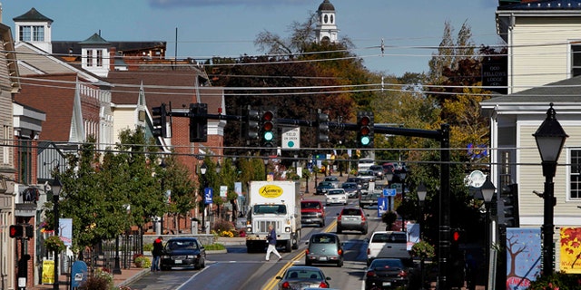 Oct. 12, 2012: A pedestrian crosses Route 1 in downtown Kennebunk, Maine.