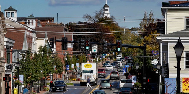Oct. 12, 2012: A pedestrian crosses Route 1 in downtown Kennebunk, Maine.