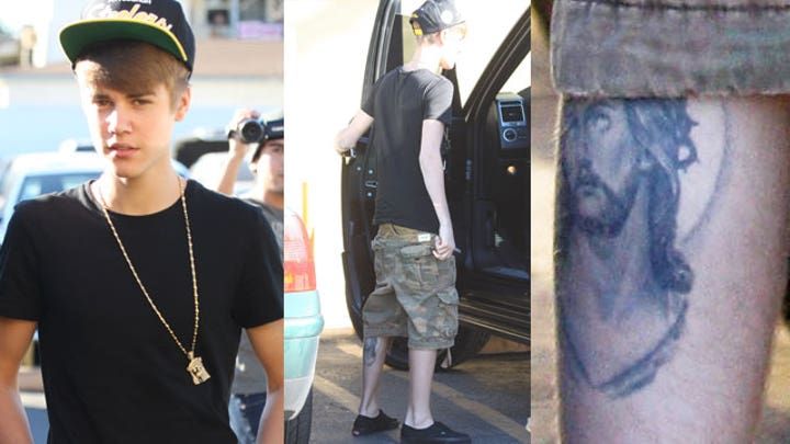 Close-up of Justin Bieber's Jesus portrait tattoo on his leg