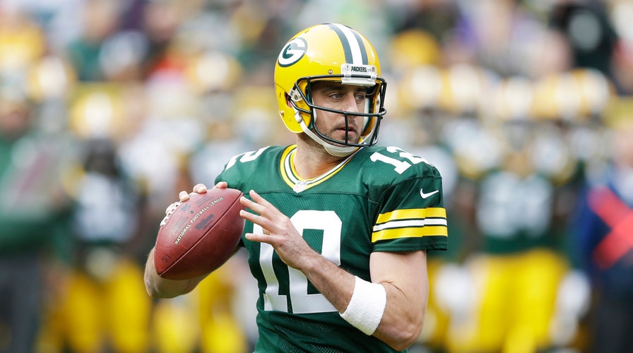 Green Bay Packers' Aaron Rodgers donates helmets to high schools