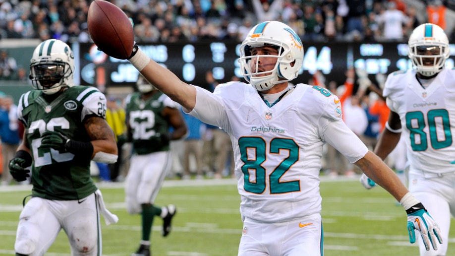 6750a588-Dolphins Jets Football