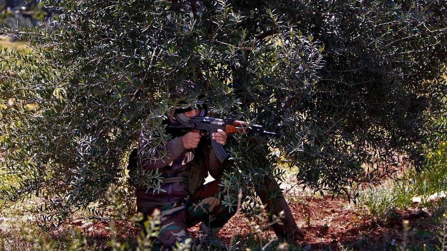 APTOPIX Mideast Lebanon Syria Shiite Fighters
