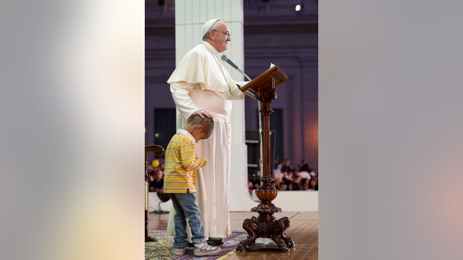 410b1caa-Vatican Pope Child on Stage