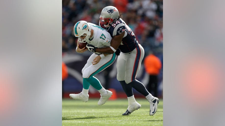 7cc6c4fd-Dolphins Patriots Football