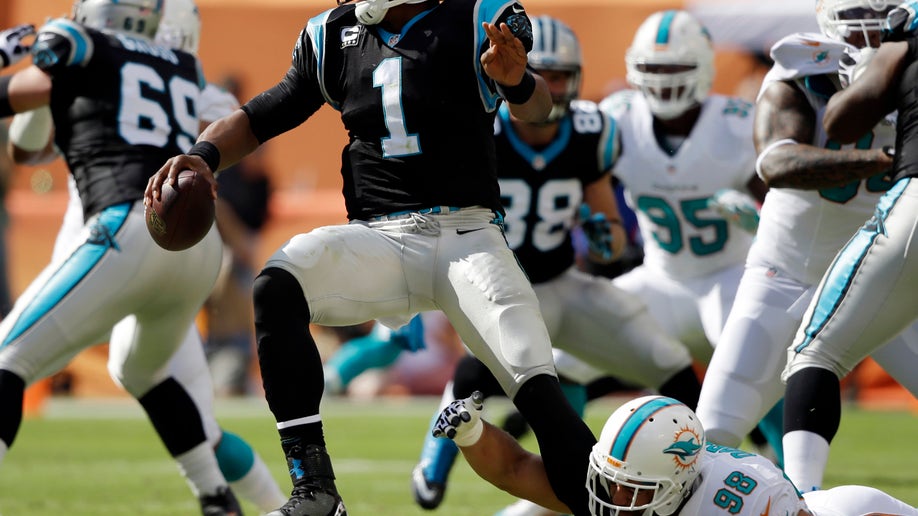 b86b0ead-Panthers Dolphins Football