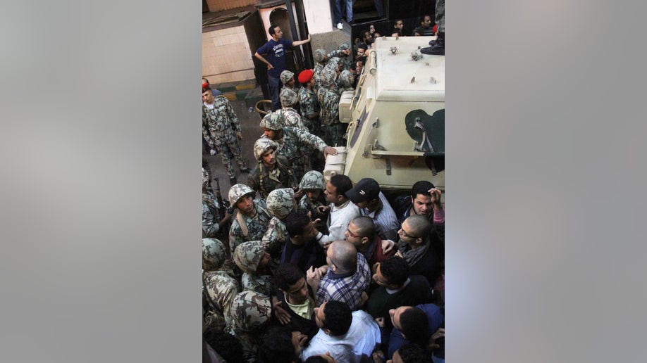 3d5c7549-Mideast Egypt State Security Return