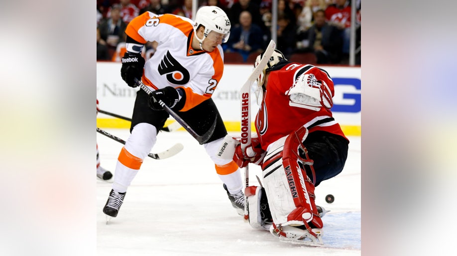 64d774b8-Flyers Devils Hockey