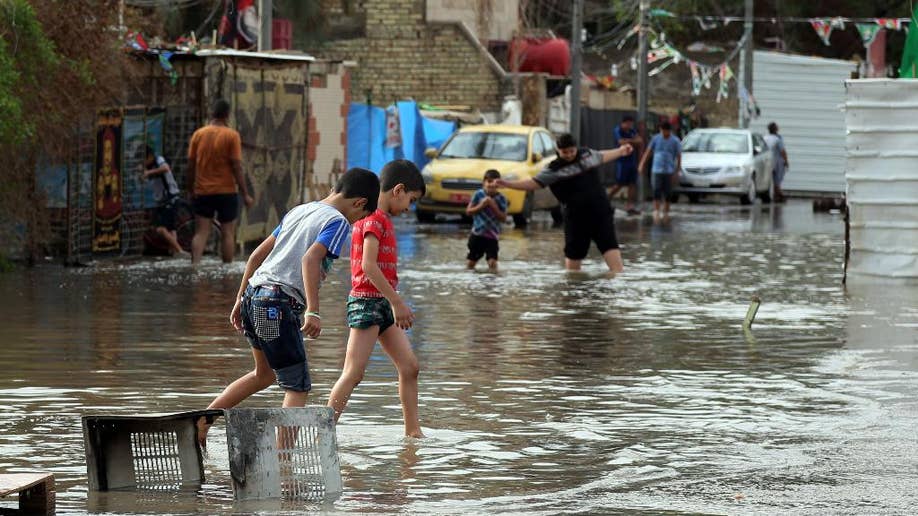 Floods paralyze Iraqi capital as heavy rain storms continue, government