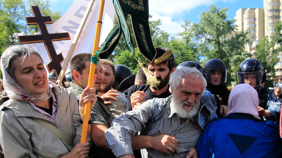 Dozens Of Russian Gay Rights Activists Detained Attacked At Rally In