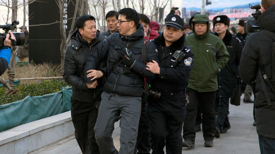 374613eb-China Journalists Under Pressure