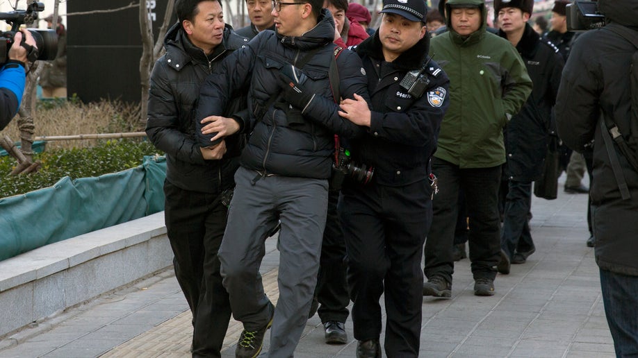 374613eb-China Journalists Under Pressure