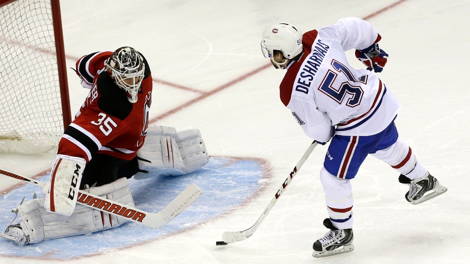 7d2e0a44-Canadiens Devils Hockey