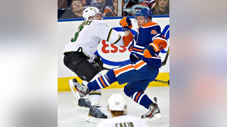 5876b731-Stars Oilers Hockey
