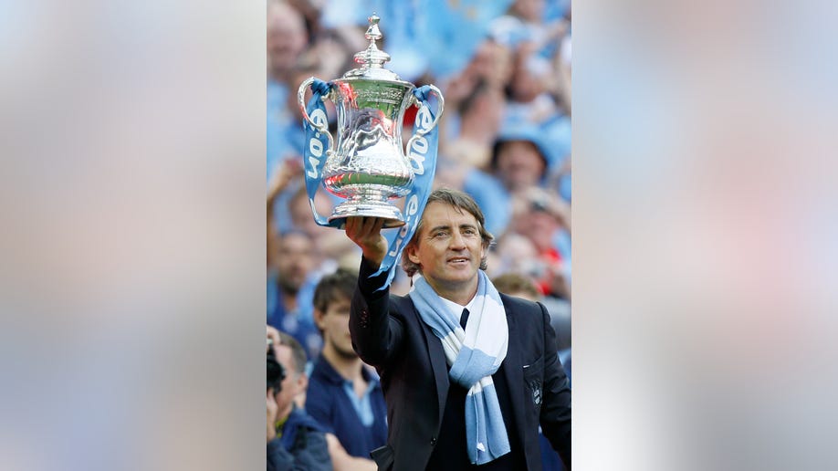 aee458ad-Britain Soccer Man City Mancini